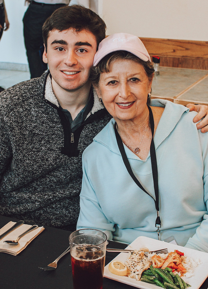 Grandon and grandma enjoying a meal.